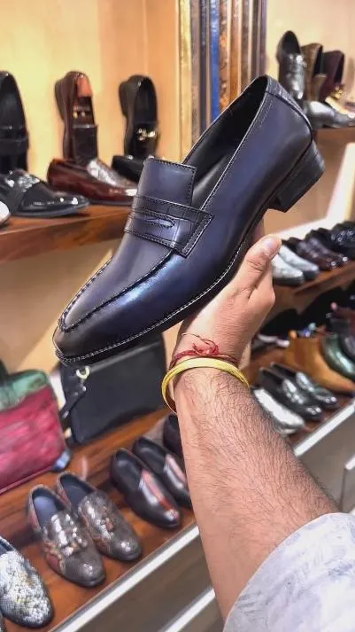 Hand-polished dark purple loafers